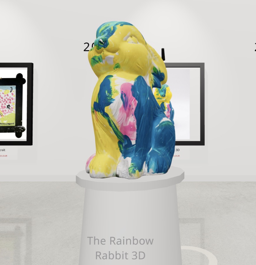 A child's clay rabbit sculpture standing on a turning gallery plinth